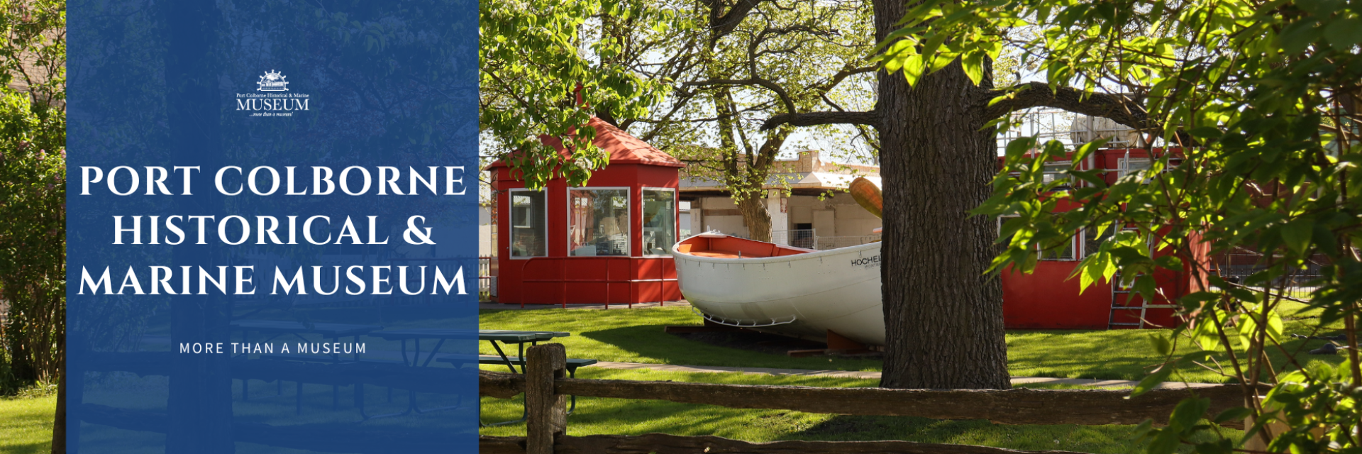 Port Colborne Historical & Marine Museum sign with red building and boat.