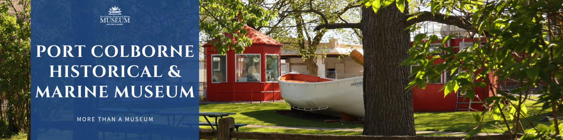 Port Colborne Historical & Marine Museum sign with red building and boat.